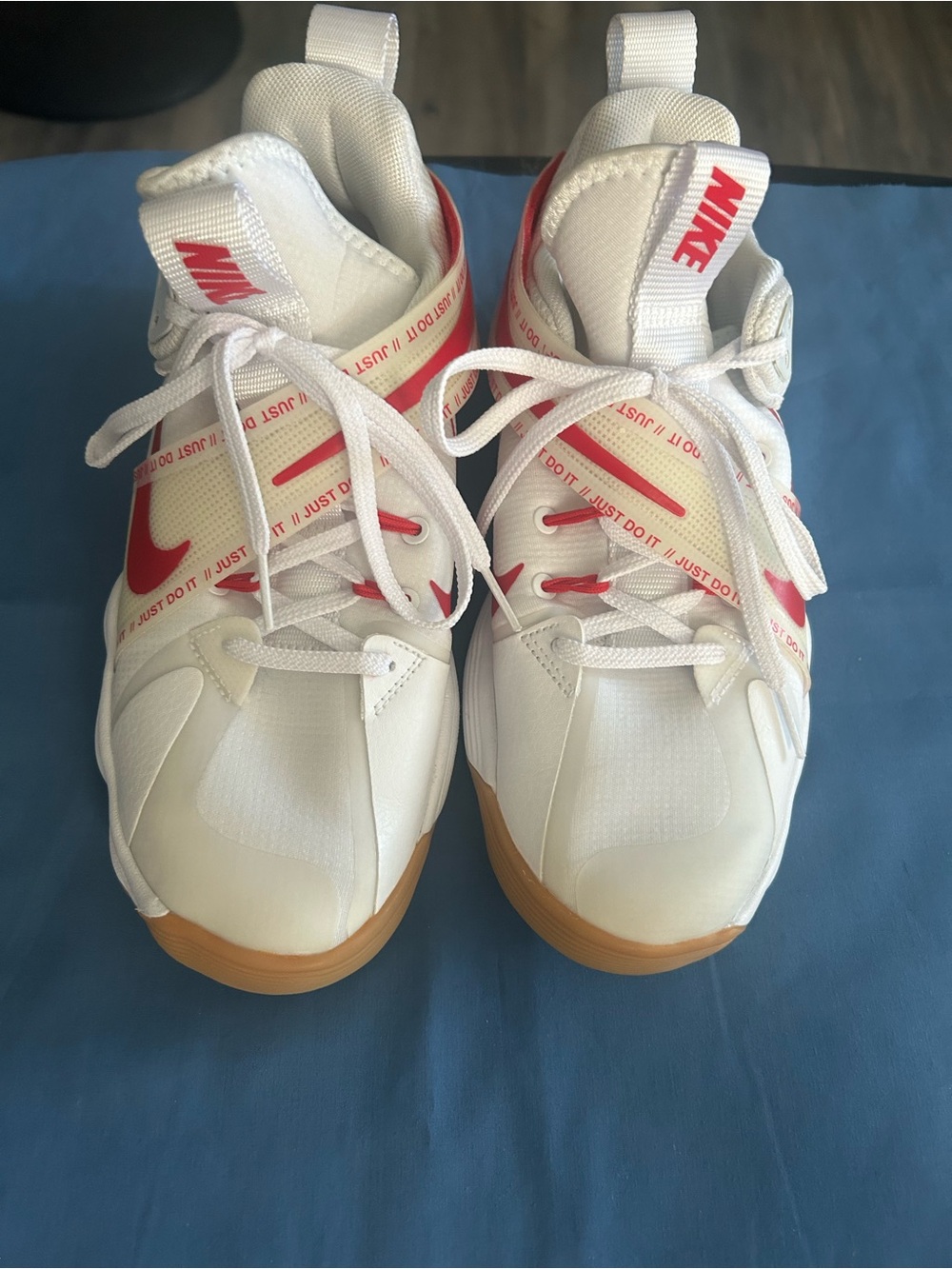 Nike White Sneakers with Red Accents and Gum Sole
